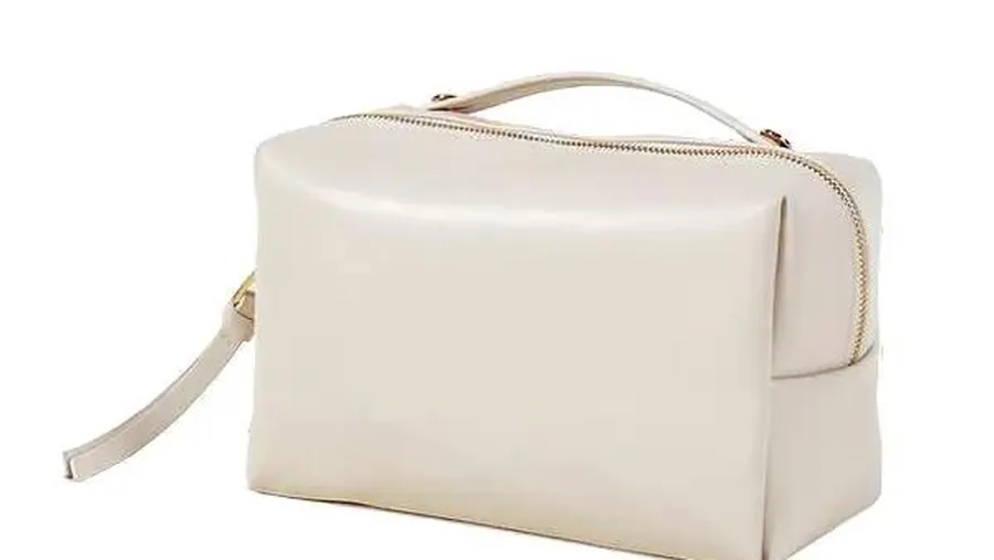 Cosmetic bag sample prototype placed on a worktable